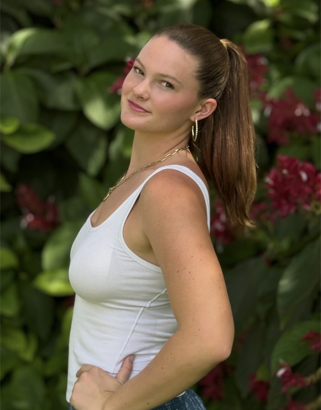 Cailyn Campbell in a white tank top outdoors