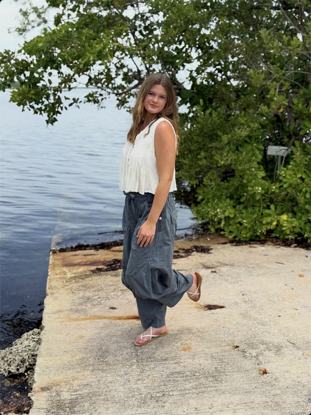 Cailyn Campbell by the water in a casual outfit