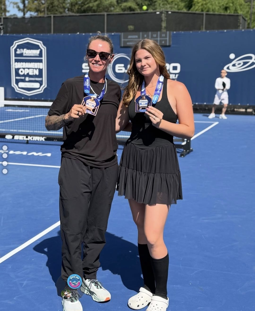 Cailyn Campbell with medal on court