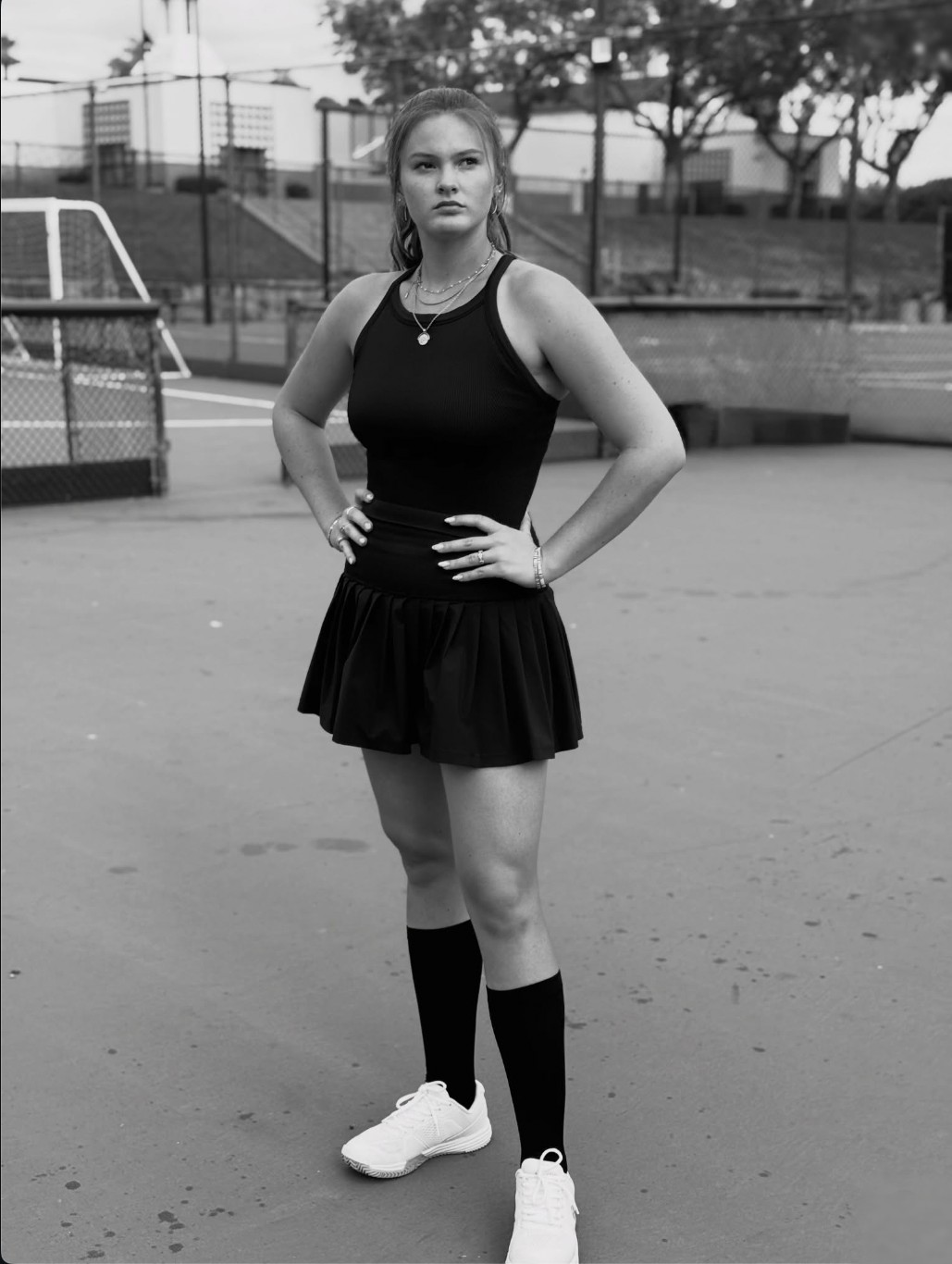 Cailyn Campbell standing on court, black and white portrait